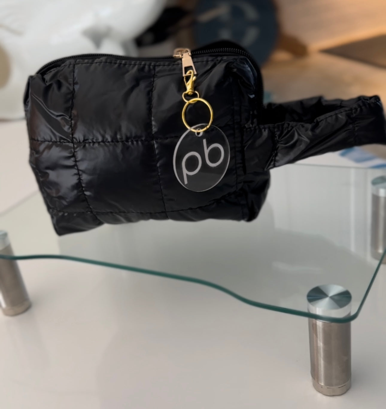 Black puffer accessory bag with handle strap